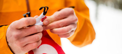 person holding climbing skins