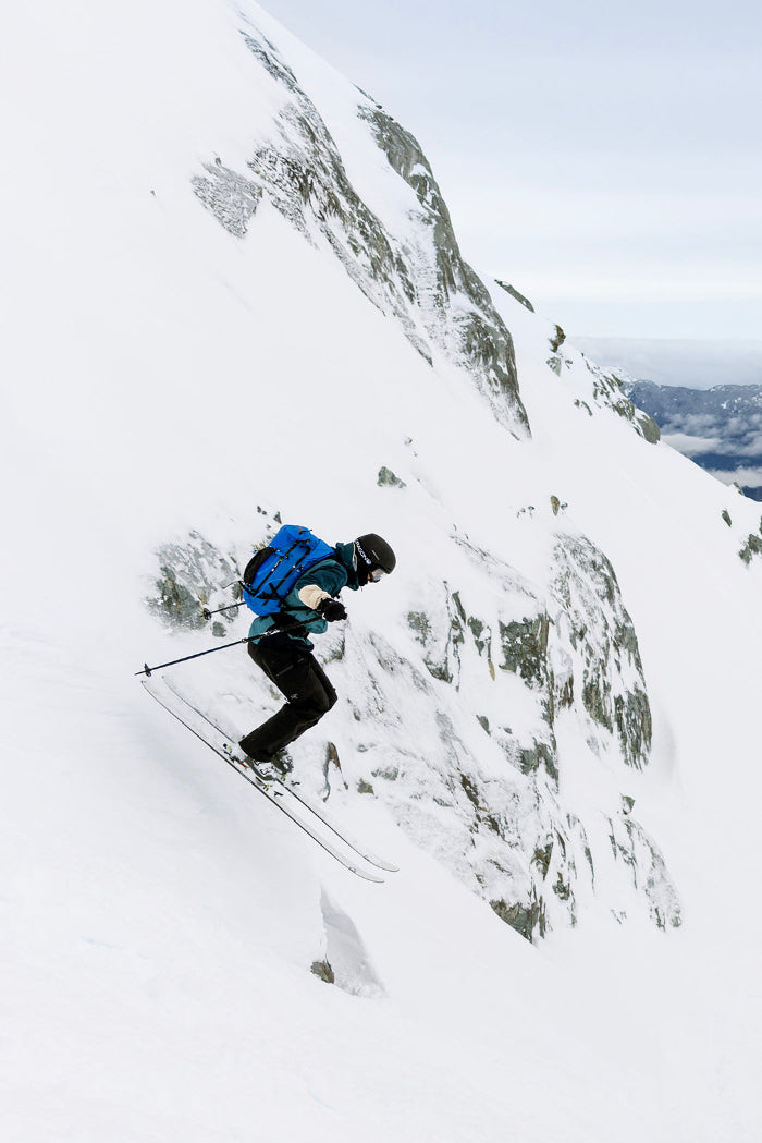 skier skiing down a steep slope